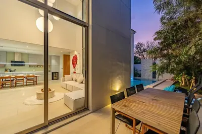 a dining room and living room of a house at V183 Lux Pride Villas 3BR Private Pool Retreat in Bang Tao Beach