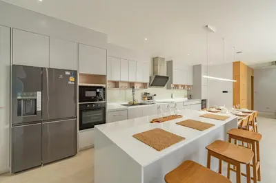 a kitchen with a large white island in a kitchen at V183 Lux Pride Villas 3BR Private Pool Retreat in Bang Tao Beach