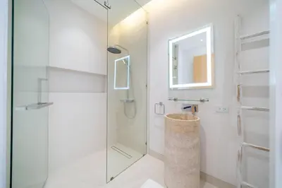 a bathroom with a shower and a glass door at Designer 3BR Pool Villa in New Build LuxPride 4 L8 Residence in Bang Tao Beach
