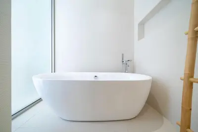 a white bath tub in a bathroom with a window at Designer 3BR Pool Villa in New Build LuxPride 4 L8 Residence in Bang Tao Beach