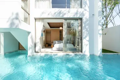 a villa with a swimming pool and a bedroom at Designer 3BR Pool Villa in New Build LuxPride 4 L8 Residence in Bang Tao Beach