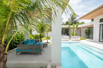 an image of a villa with a swimming pool at Mouana Breeze Maikhao VIP 4-bedroom Pool Villa 9916 in Mai Khao Beach