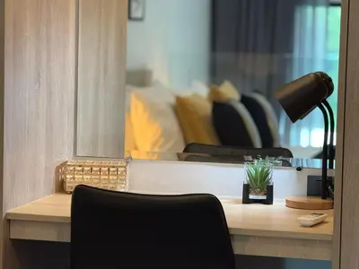 a desk with a lamp and a chair in a room at C181 Stylish 1BR Loft Near Naiharn Beach Pool Gym in Rawai Beach