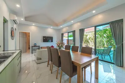 a kitchen and dining room with a table and chairs at V193 Next-Door Villas 6BR 2 Pools For Group Vibe! in Rawai Beach