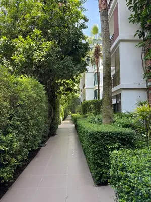a sidewalk in front of a building with trees at Title Rawai Phase III By Mill 1 fl in Rawai Beach