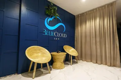 two chairs in front of a blue wall with a sign at Great 1BDR Kamala 500m to beach in Kamala Beach