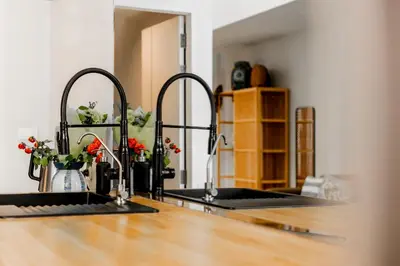 a kitchen with two sinks and a counter top at ORIGINAL DESIGNED 2BR TownHouse6 MonkeyHill in Ban Sam Kong