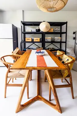 a wooden table and chairs in a room at ORIGINAL DESIGNED 2BR TownHouse6 MonkeyHill in Ban Sam Kong