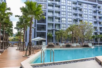 a hotel with a swimming pool and a building at C182 Kamala 1BR Stay Near Beach & Attractions in Kamala Beach