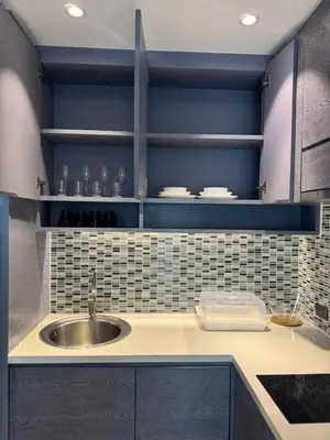 a kitchen with a sink and blue walls at C182 Kamala 1BR Stay Near Beach & Attractions in Kamala Beach
