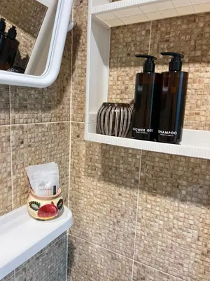 a coffee maker on a shelf in a bathroom at Fran Sim Da Guest House in Bang Tao Beach