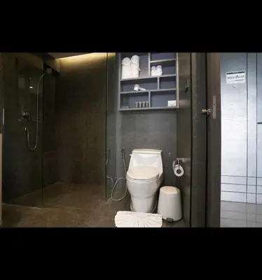 a bathroom with a toilet and a shower at City Gate Apartments Kamala Beach Phuket Thailand - LMY in Kamala Beach
