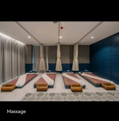 a room with four beds in it with curtains at City Gate Apartments Kamala Beach Phuket Thailand - LMY in Kamala Beach