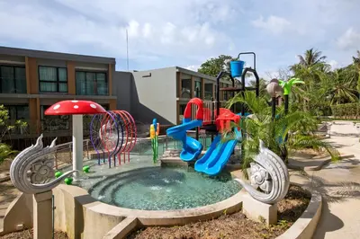 a playground with a water slide and slides at 1bdr Modern Apartment Cozy Seaview Stay in Surin Beach