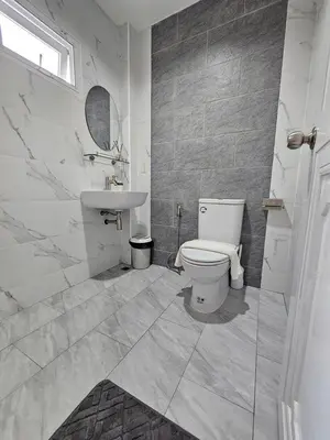 a bathroom with a toilet and a sink at The Green View Pool Villa in Kamala Beach