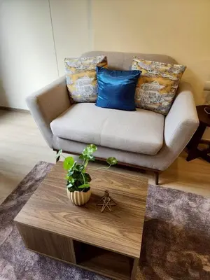 a living room with a couch and a coffee table at The Base Central Phuket-B42WL in Ban Rangeng