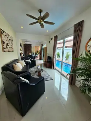 a living room with a couch and a ceiling fan at Cozy 3 Bedrooms Pool Villa near Nai Harn Beach in Rawai Beach