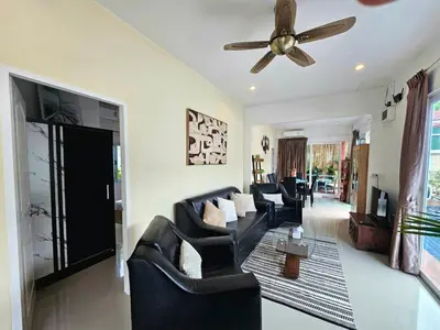 a living room with couches and a ceiling fan at Cozy 3 Bedrooms Pool Villa near Nai Harn Beach in Rawai Beach