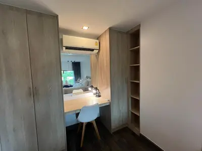 a room with a desk and a chair in a room at Modern Naiharn Beach Duplex Apartment in Rawai Beach