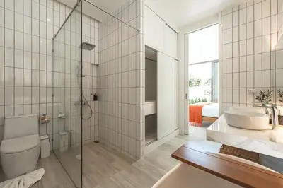 a bathroom with a shower and a toilet and a sink at V185 New Modern Villa with Private Pool in Bang Tao Beach