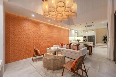 a living room with a couch and a table at V185 New Modern Villa with Private Pool in Bang Tao Beach
