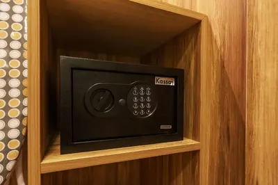 a small tv in a wooden box in a cabinet at Perfect Studio 3 pools Nai Harn in Rawai Beach