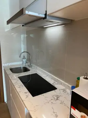 a kitchen with a sink and a counter top at Perfect Studio 3 pools Nai Harn in Rawai Beach
