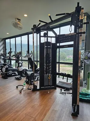 a gym with a bunch of treadmills and machines at Perfect Studio 3 pools Nai Harn in Rawai Beach