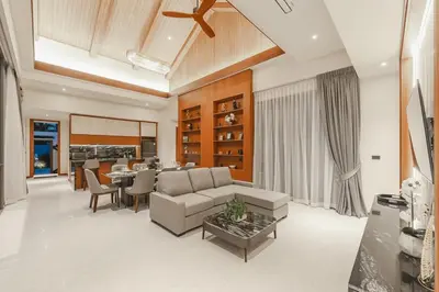 a living room with a couch and a table at V186 Quiet Glamour Oasis 4BR Poolside Sanctuary in Bang Tao Beach