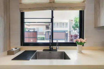 a kitchen counter with a sink and a window at V187 Walkable to Beach Very modern Jacuzzi pool in Rawai Beach
