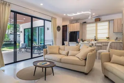 a living room with two couches and a kitchen at V187 Walkable to Beach Very modern Jacuzzi pool in Rawai Beach