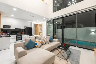 a living room with a couch and a kitchen at V190 Tropical Oasis 3BR Villa with Pool & Bathtub in Rawai Beach