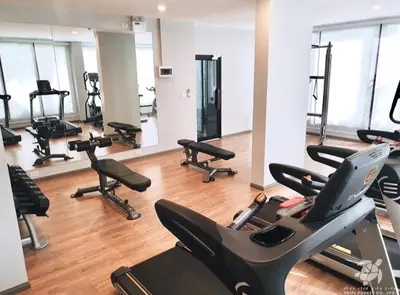 a gym with several treadmills and exercise bikes at B8 Ватсап669З5В2I976 in Nai Yang Beach