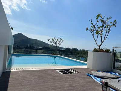 a swimming pool on top of a building at Fantasea Condominium Kamala in Kamala Beach