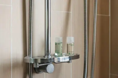 a mirror with two bottles on a bathroom door at C185 Centrio 2BR Condo Walk to Mall Near Town in Phuket Town