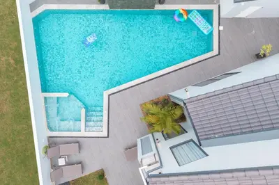 an overhead view of a swimming pool next to a house at V192 Brand New Golf side 5BR Villa with Private Pool in Kathu