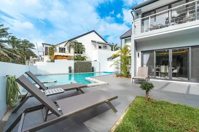 a villa with a swimming pool and a house at V192 Brand New Golf side 5BR Villa with Private Pool in Kathu