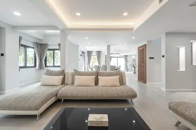 a living room with a couch and a table at V192 Brand New Golf side 5BR Villa with Private Pool in Kathu