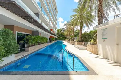 a swimming pool in the middle of a building at C189 Beachside Luxury in Rawai Sea View and Gym in Rawai Beach