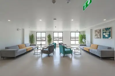 a large lobby with couches and chairs and tables at C190 Sleek 1BR with Infinity Pool, Gym, Rooftop in Kamala Beach