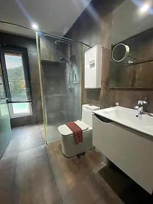a bathroom with a tub and a toilet and a sink at 3-Bedroom Town House in Kamala in Kamala Beach