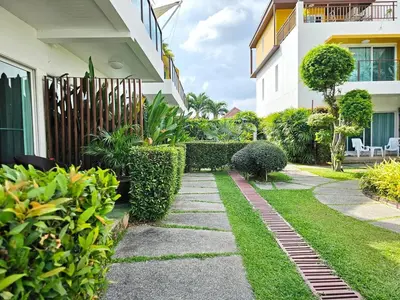 a garden in front of a building at 3-Bedroom Town House in Kamala in Kamala Beach