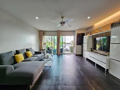 a living room with a couch and a ceiling fan at 3-Bedroom Town House in Kamala in Kamala Beach