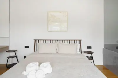 a bedroom with a bed with two white towels on it at Modern 3 Bdr Villa Tree O'Clock Bangtao With a Pool in Ban Pak Lak