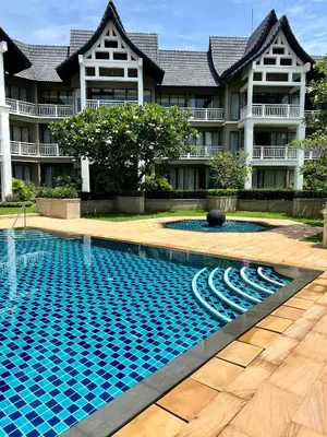 a swimming pool in front of a building at Allamanda 3 Laguna Phuket by Star in Laguna Phuket