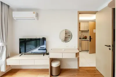 a bathroom with a dressing table and a mirror at Cozy New 1-Bedroom Apartment with Pool, 5 Min Walk to Kamala Beach in Kamala Beach