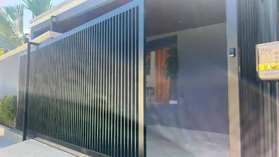 a entrance to a building with a metal door at Rawai Villa in Rawai Beach