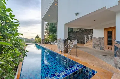 a swimming pool in a house at C195 Romantic 1BR Ocean Views Cozy & Bright in Kata Beach