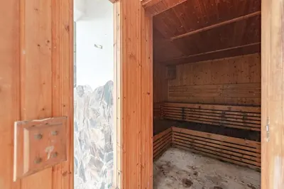 an empty wooden room with a glass door of a cage at C195 Romantic 1BR Ocean Views Cozy & Bright in Kata Beach