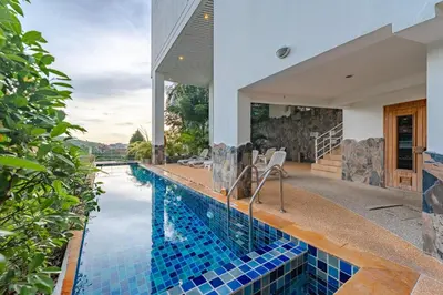 a swimming pool in a house with a house at C196 Condo 1BR Sea View & 5 Min to Beach in Kata Beach